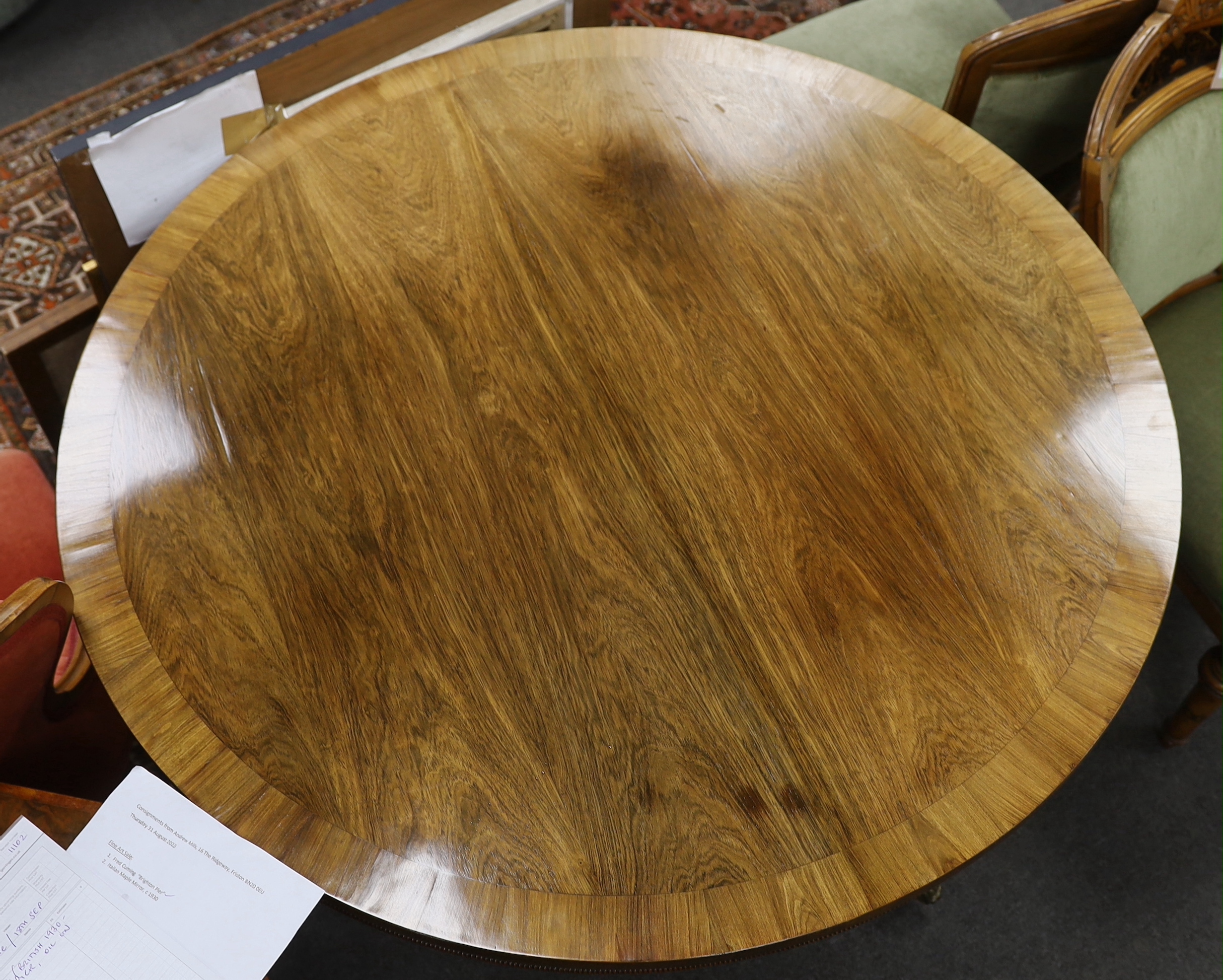 A Regency banded faded rosewood circular tilt top breakfast table, diameter 115cm, height 71cm